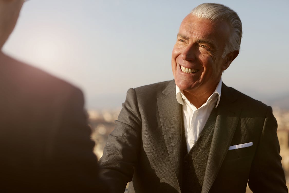 Senior business owner shaking hands on a deal