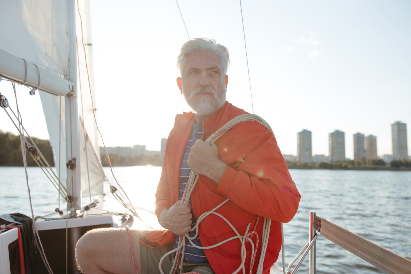 Senior business owner on a sailboat looking ahead